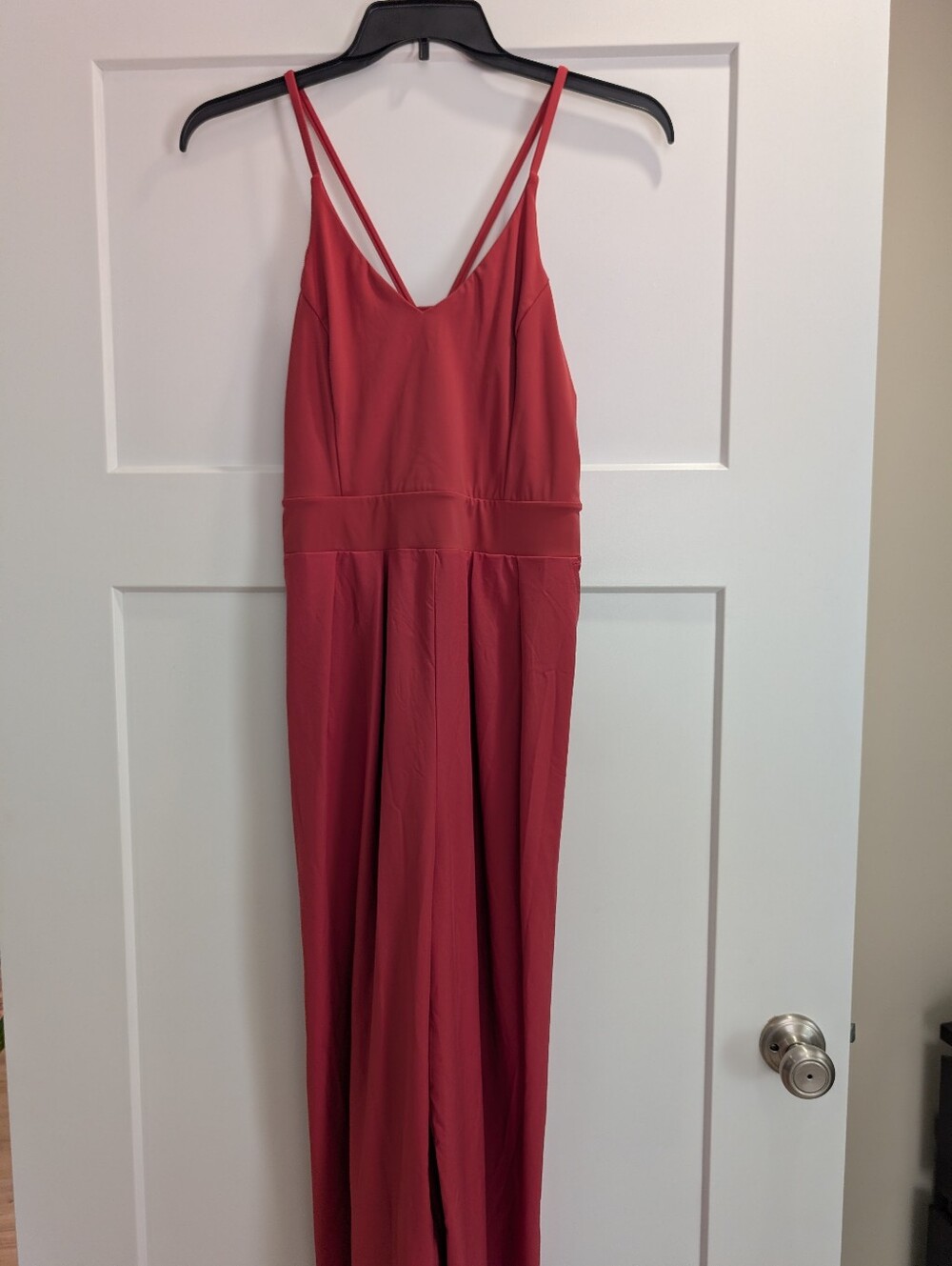 Halara Breezeful jumpsuit features adjustable spaghetti straps and pockets.